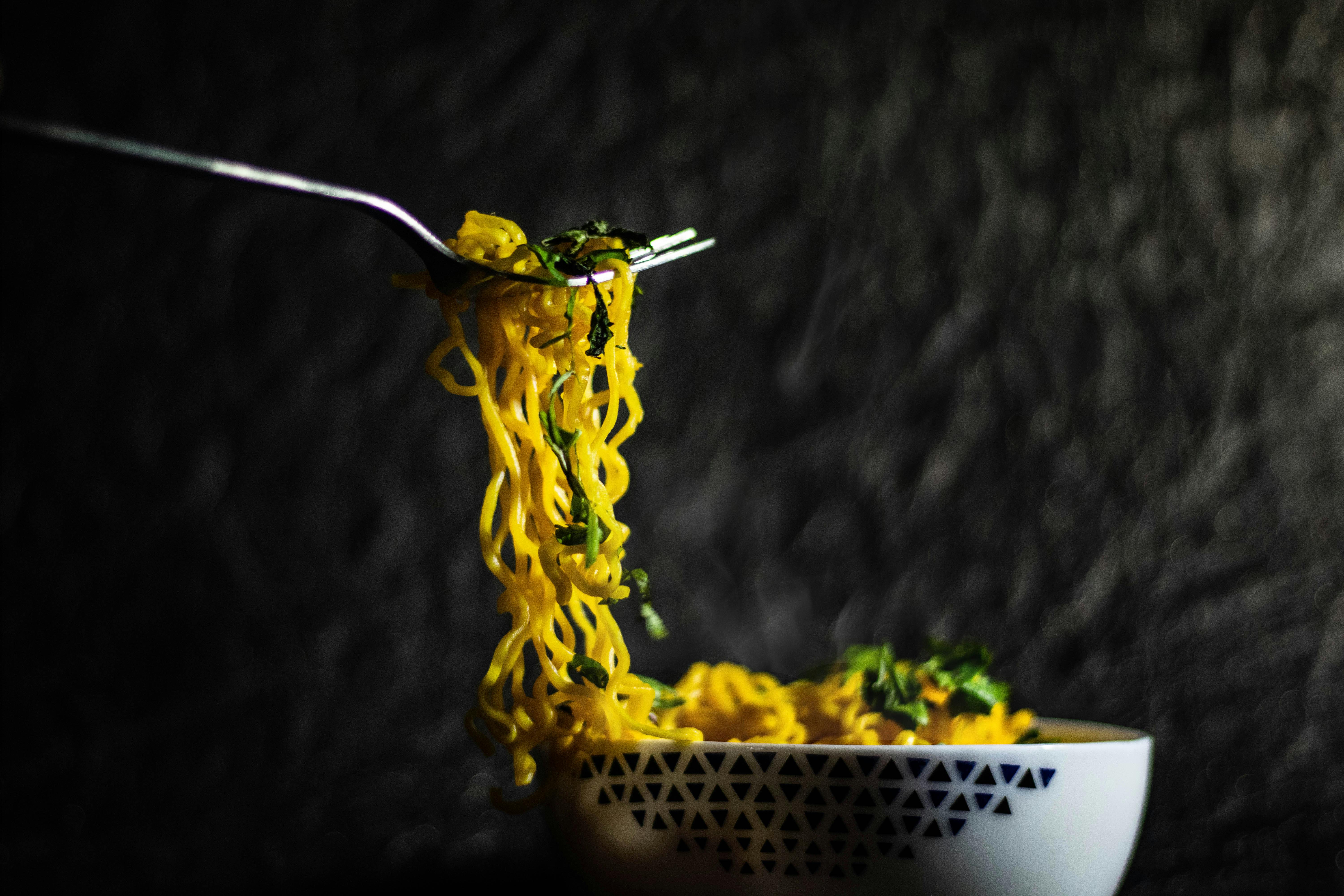 photo-of-noodles-on-fork-free-stock-photo