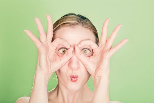 Free Woman Doing Goggles Hands Gesture Stock Photo