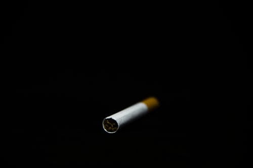 Free stock photo of black background, blur, cigarette Stock Photo