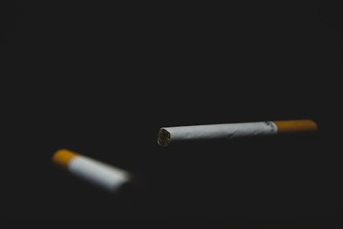 Free stock photo of black background, blur background, cigarette Stock Photo