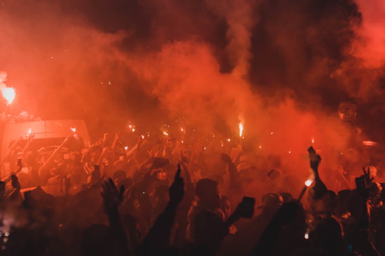 Expressive Fans Celebrating Victory On Street At Night