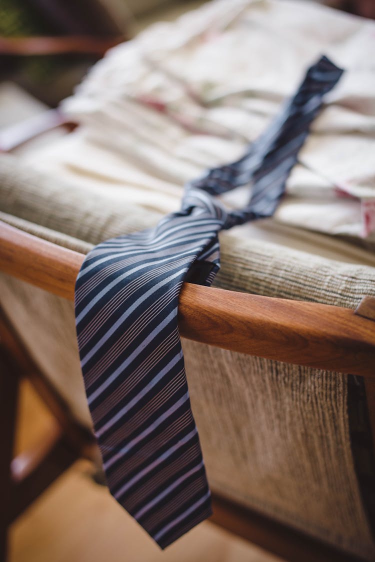 Striped Blue Tie Placed On Chair