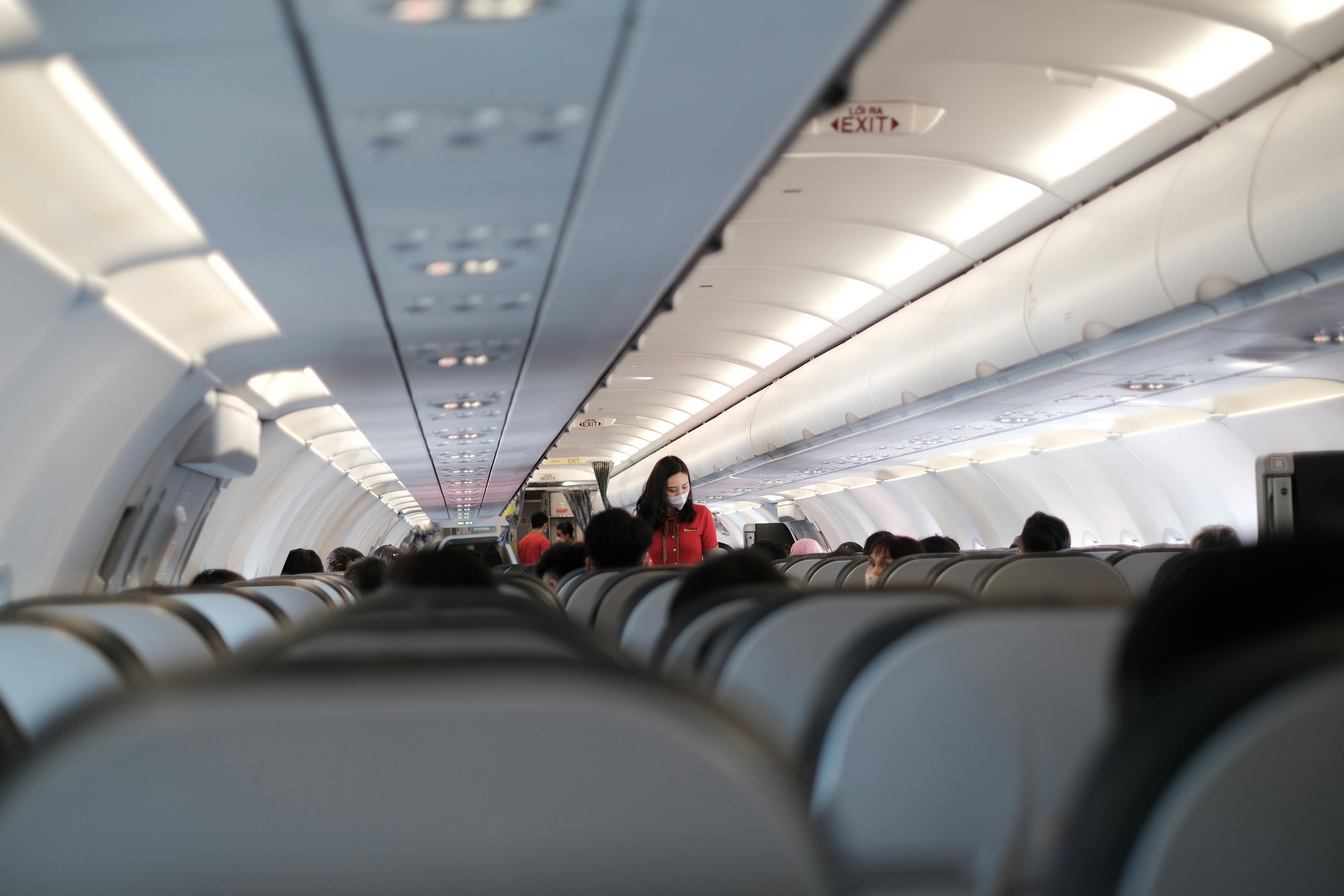 People Sitting on Airplane Seats · Free Stock Photo