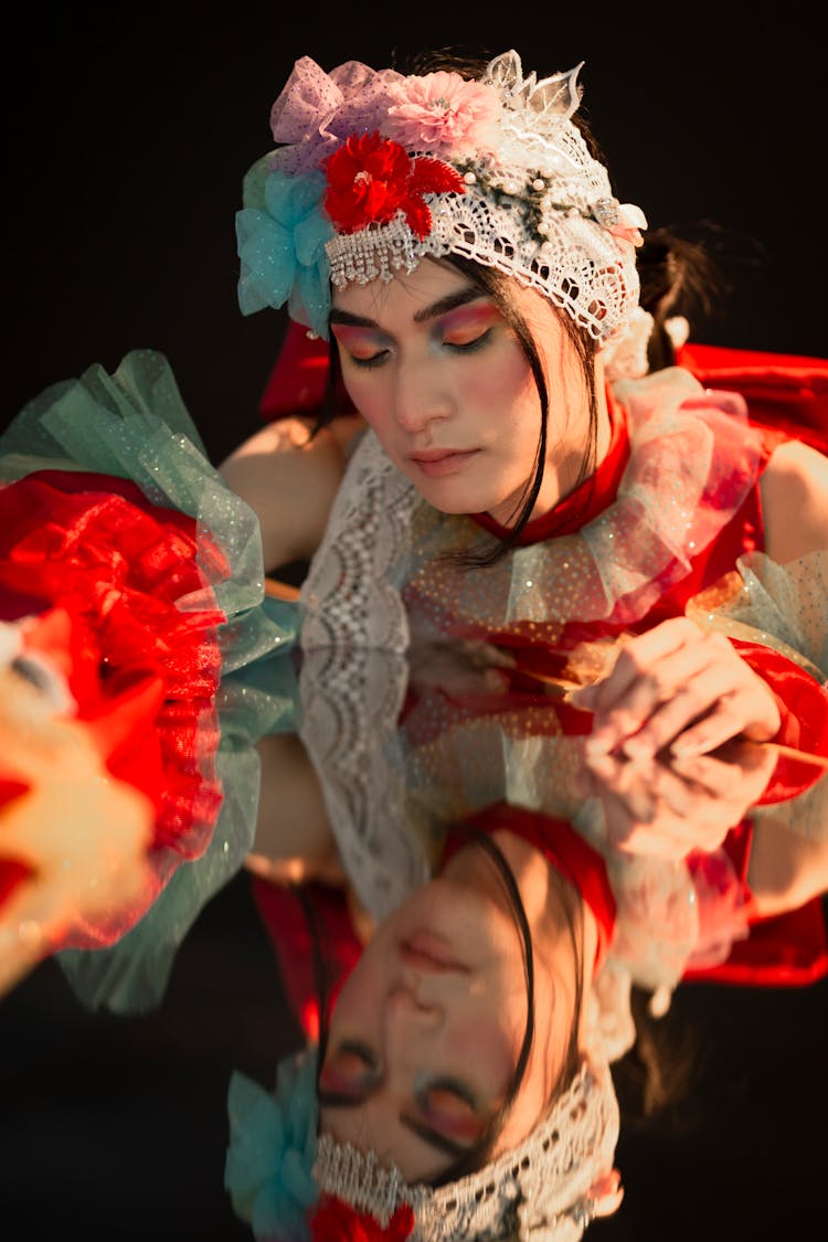 Graceful Woman At Mirrored Table