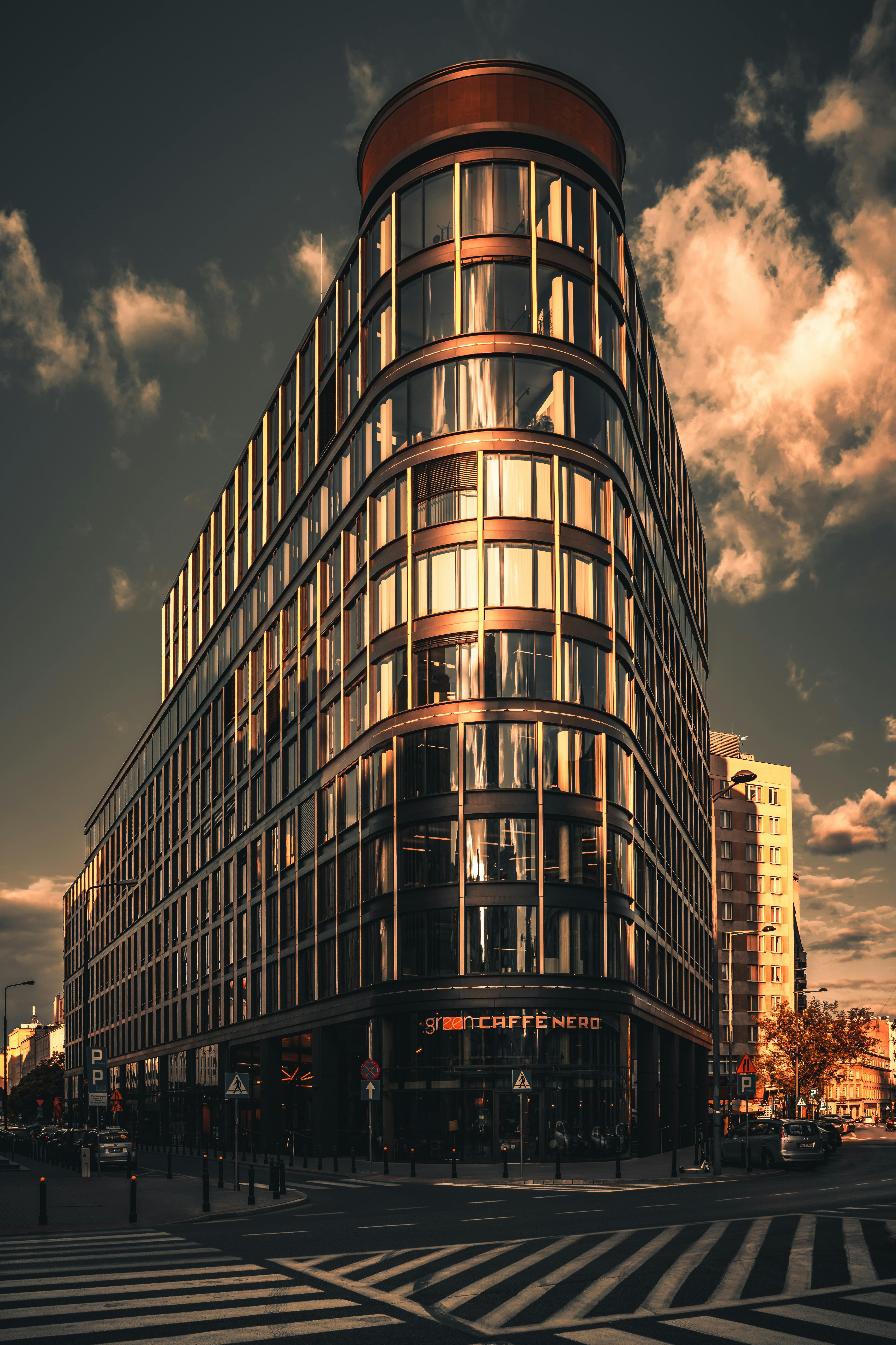 Free Modern high-rise building in Warsaw city center with dramatic lighting. Stock Photo