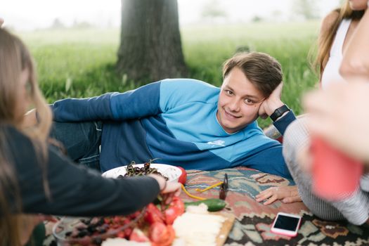 Teenage People Having Picnic in Park 