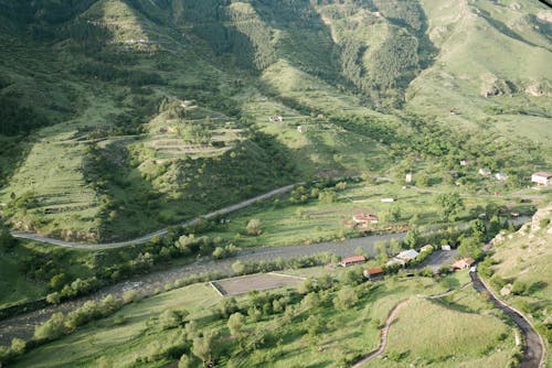 Aerial View Photo of River Near Mountain