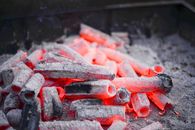 Smoldering chunks of hot firewood