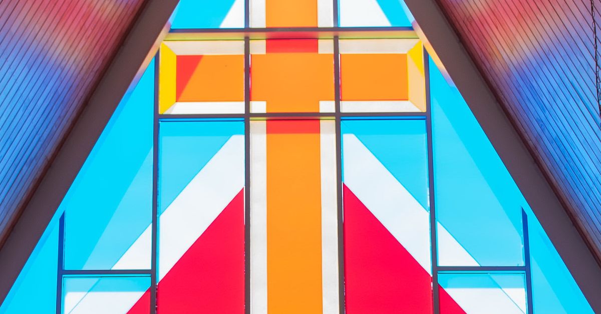 Colorful geometrical stained glass window with rood · Free Stock Photo