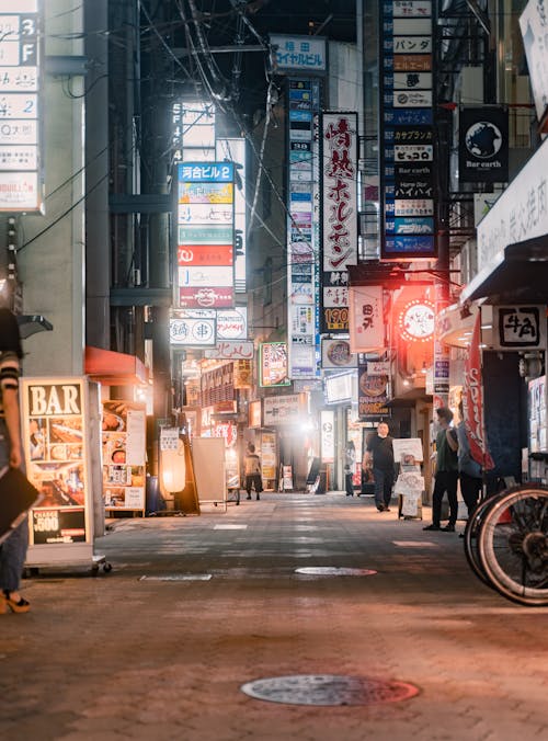 People Walking on Street during Night Time