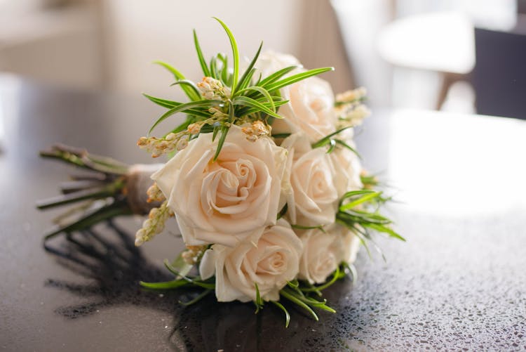 Colorful Bridal Bouquet With Leaves On Table