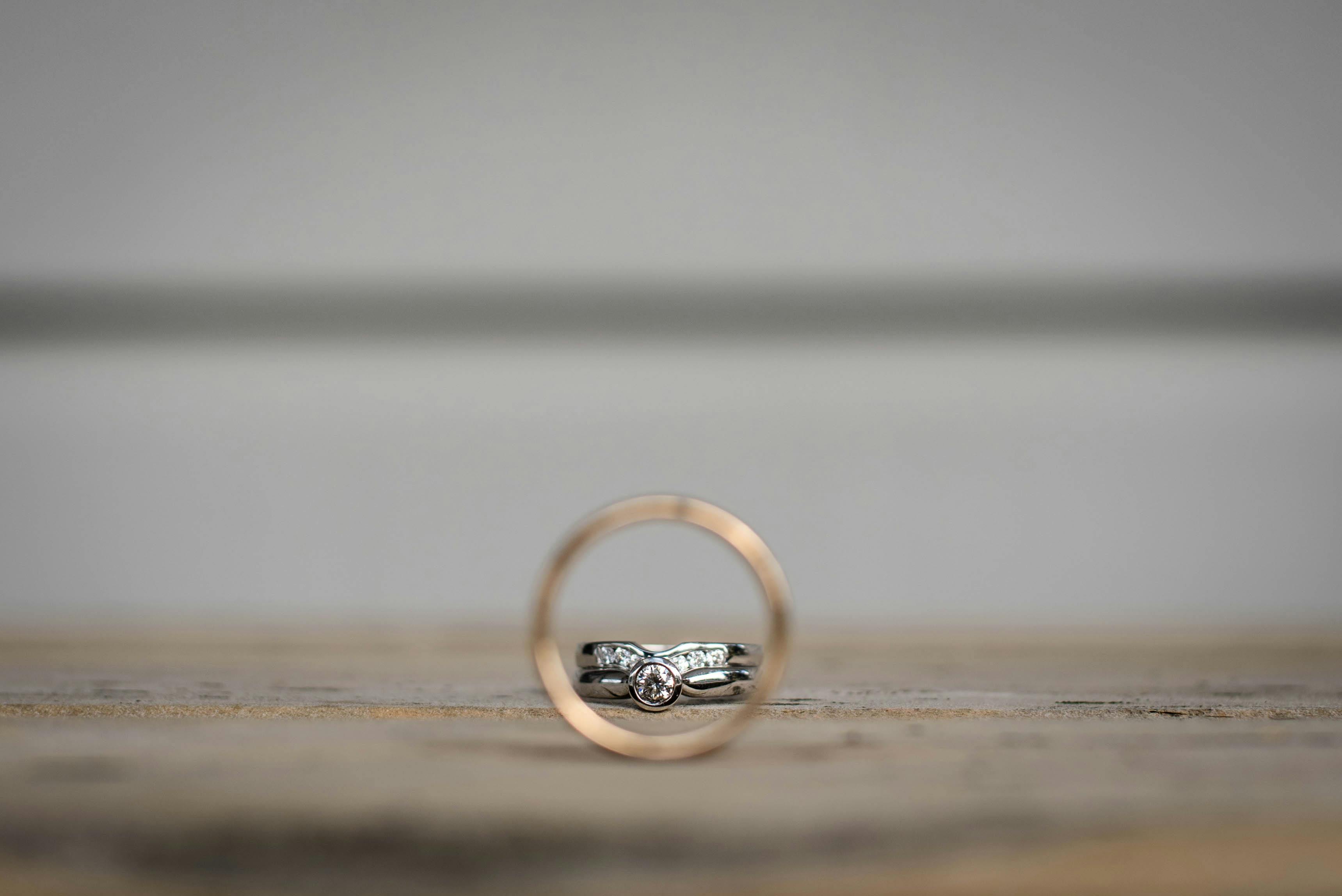 bridal rings on wooden table during festive event