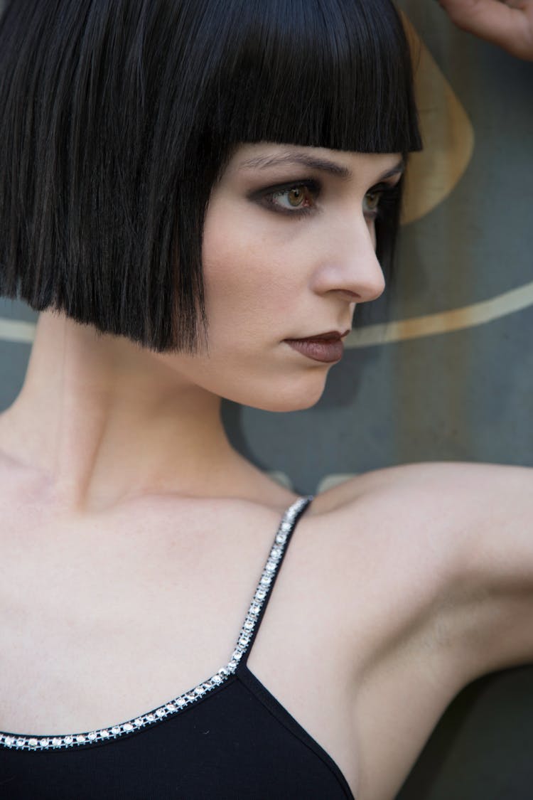 A Close Up Of A Woman With A Fringe Hairstyle