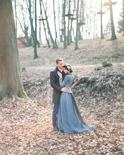 Couple in Dress and Suit in Forest