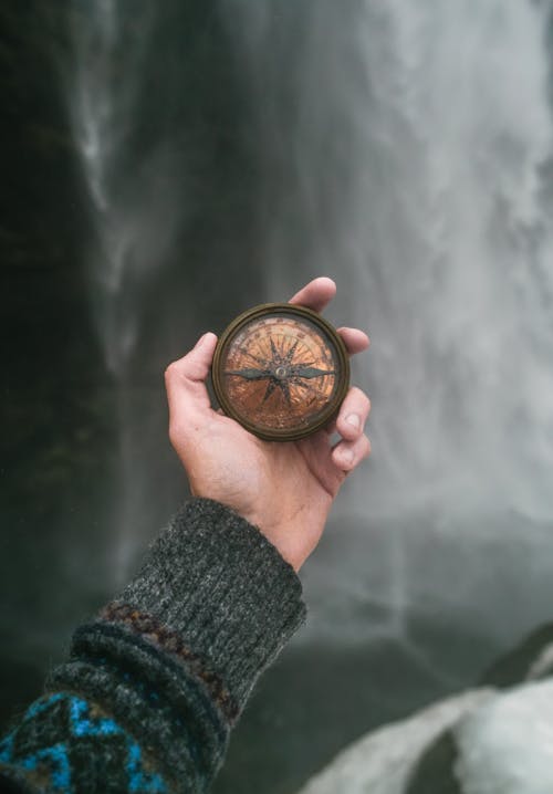 Hand Holding Compass