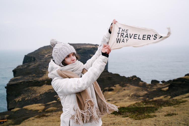 Woman Showing The Travelers Way Text