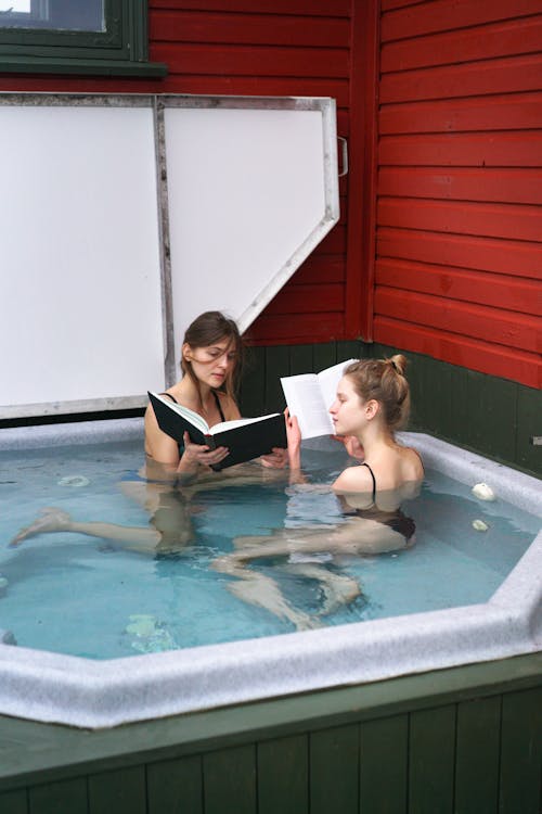 Free Women with Books in Jacuzzi Stock Photo