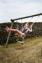 Smiling Woman on Swing