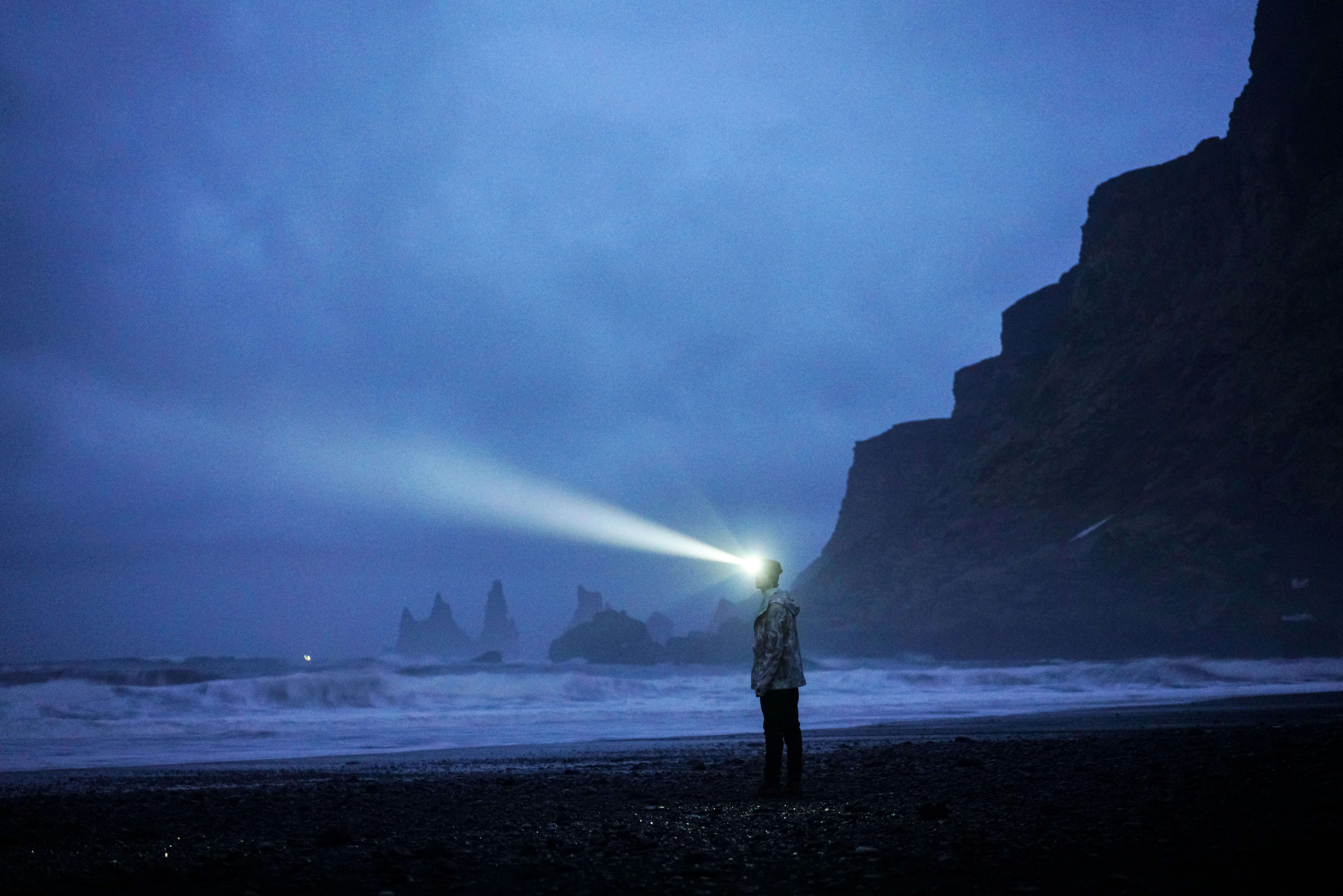 Person with Flashlight on Beach at Night · Free Stock Photo