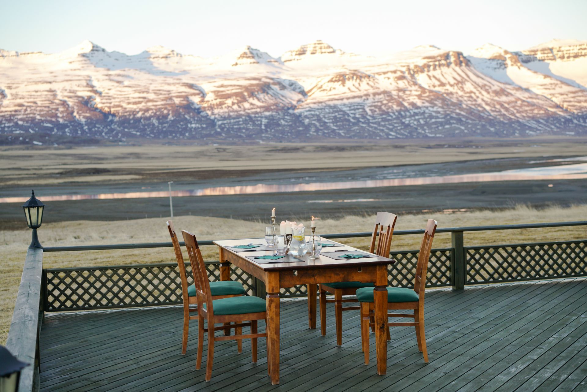 Elegant Table Setting on a Wooden Deck with a Mountain View