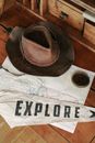 Brown Cowboy Hat on White and Black Textile