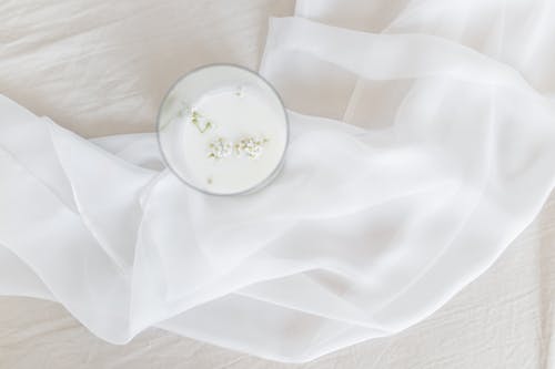 A Glass of Milk with Baby's-Breath Flowers