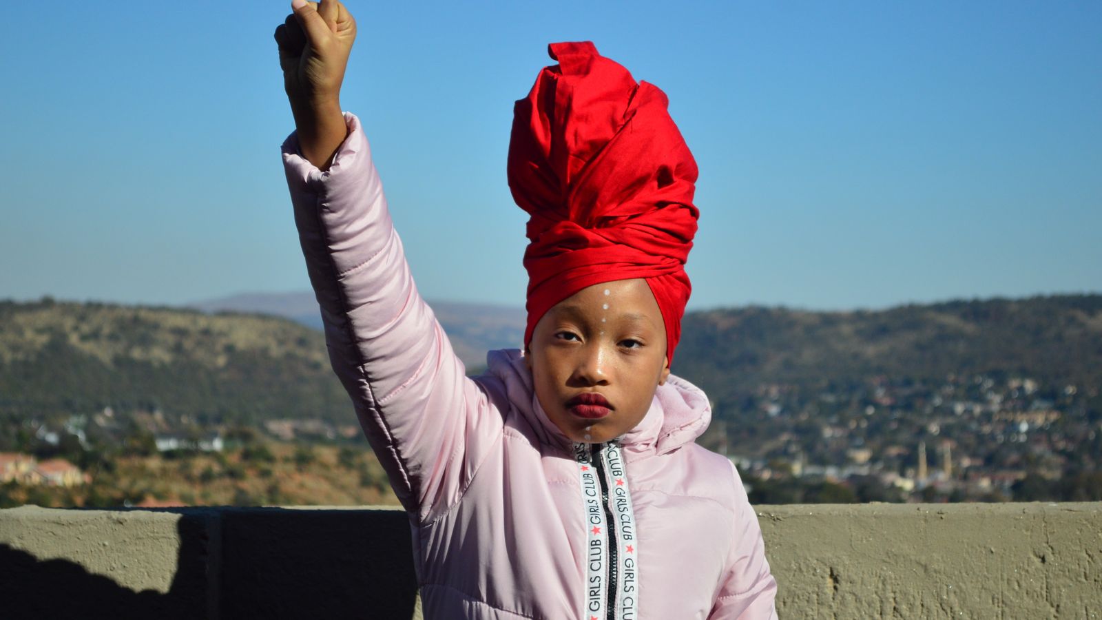 Portrait of a girl raising her arm, Eswatini
