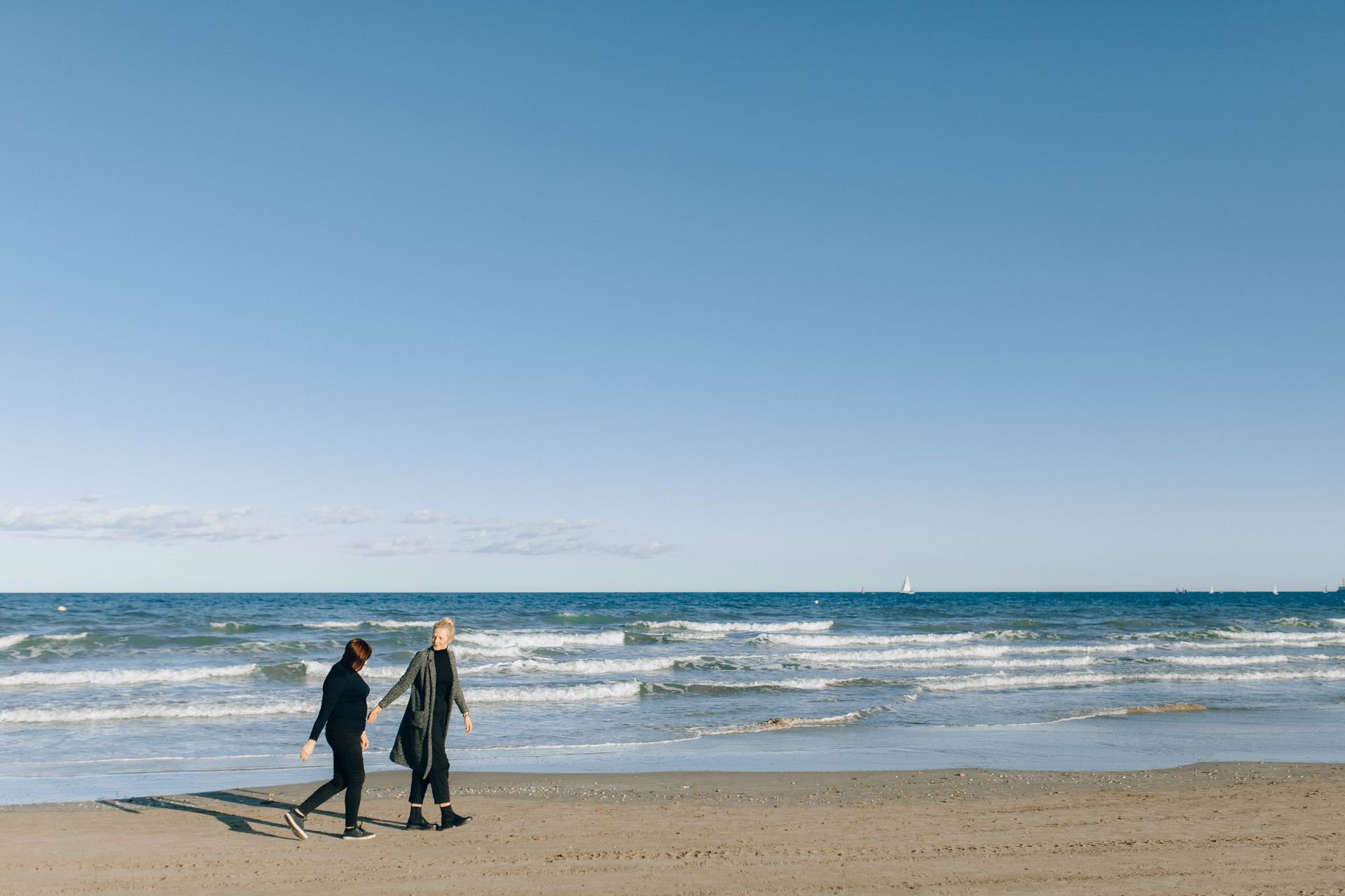 Women Walking on the Beach