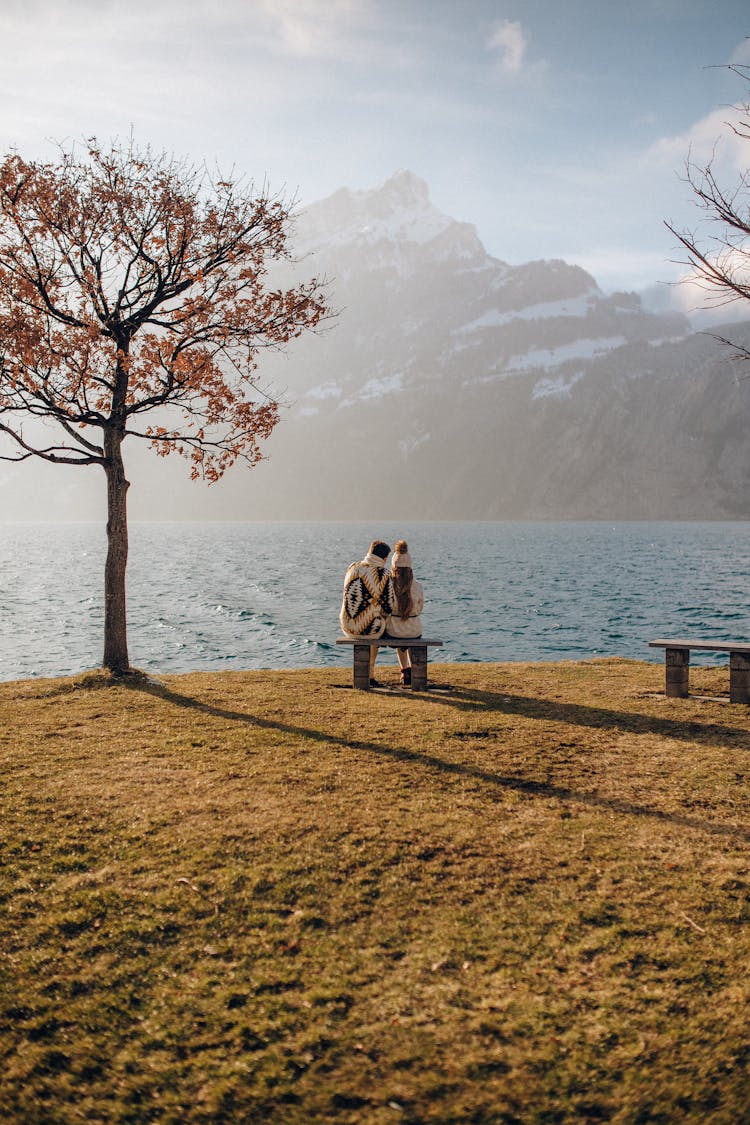 A Couple Sitting On The Bench