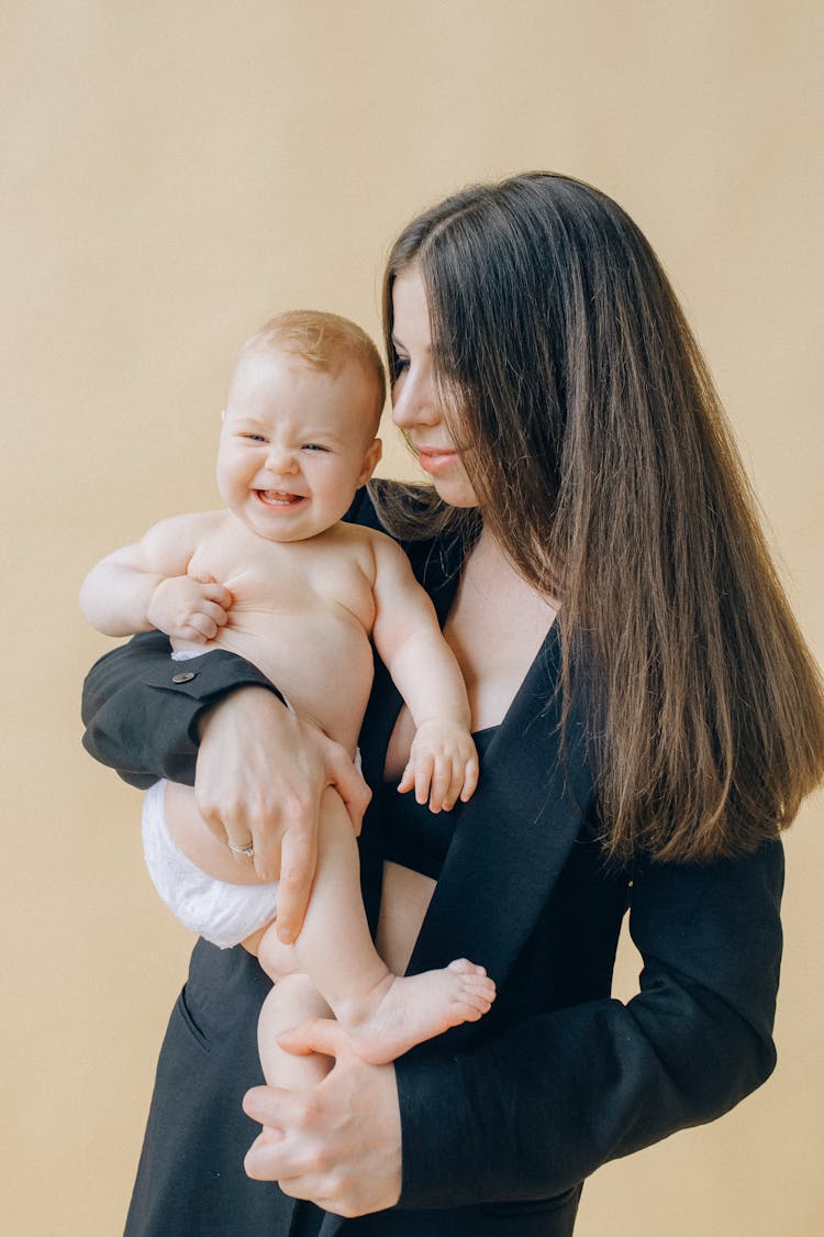 Portrait Of Woman Holding Her Baby