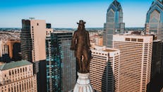 Drone view of monument of William Penn located on top of high tower in Philadelphia