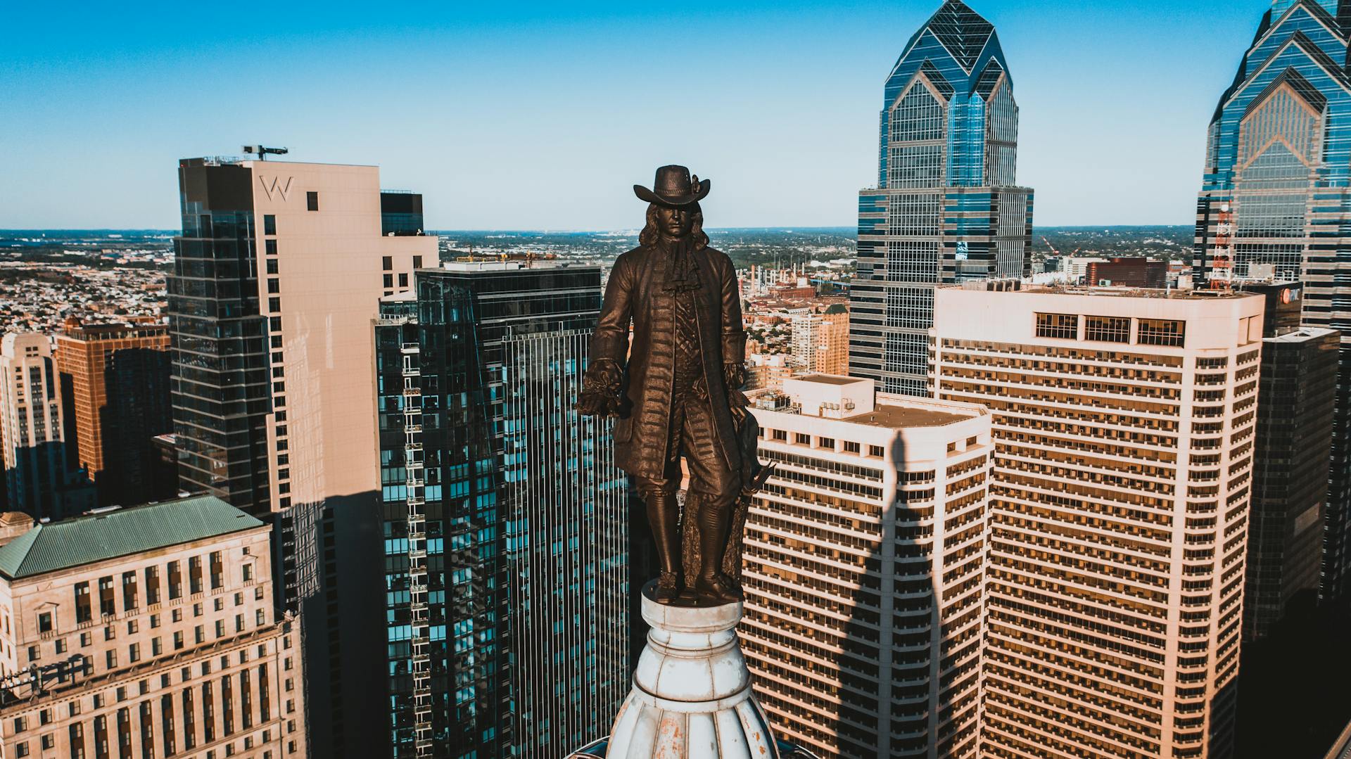 Drone view of monument of William Penn located on top of high tower in Philadelphia