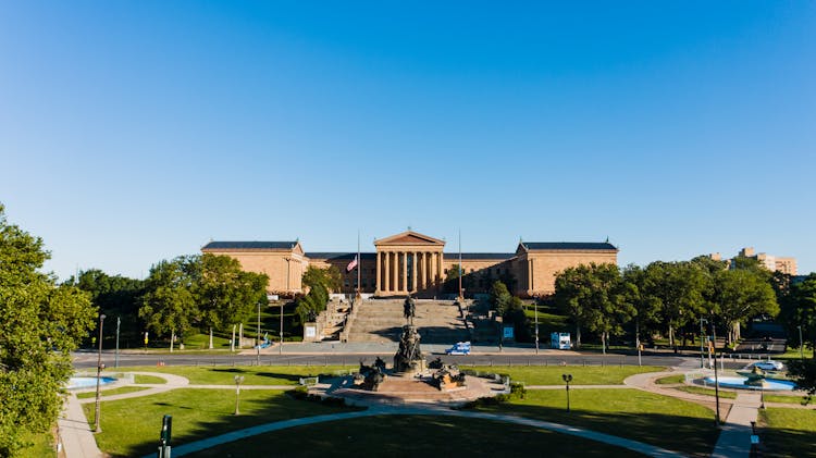 Old Museum Of Art Near Sculptures And Lawn In Philadelphia