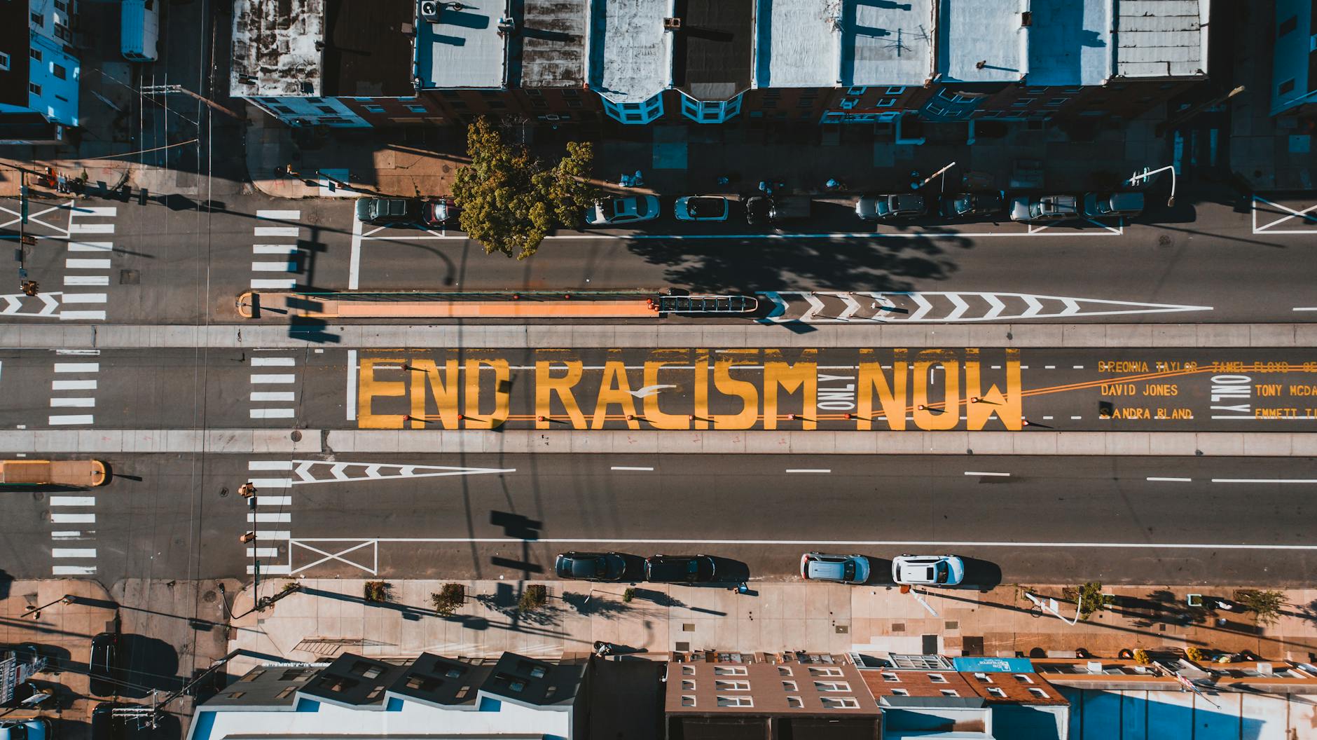 an aerial shot of a roadway painted with the words 