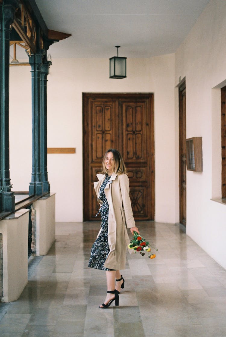 A Woman Holding Flowers