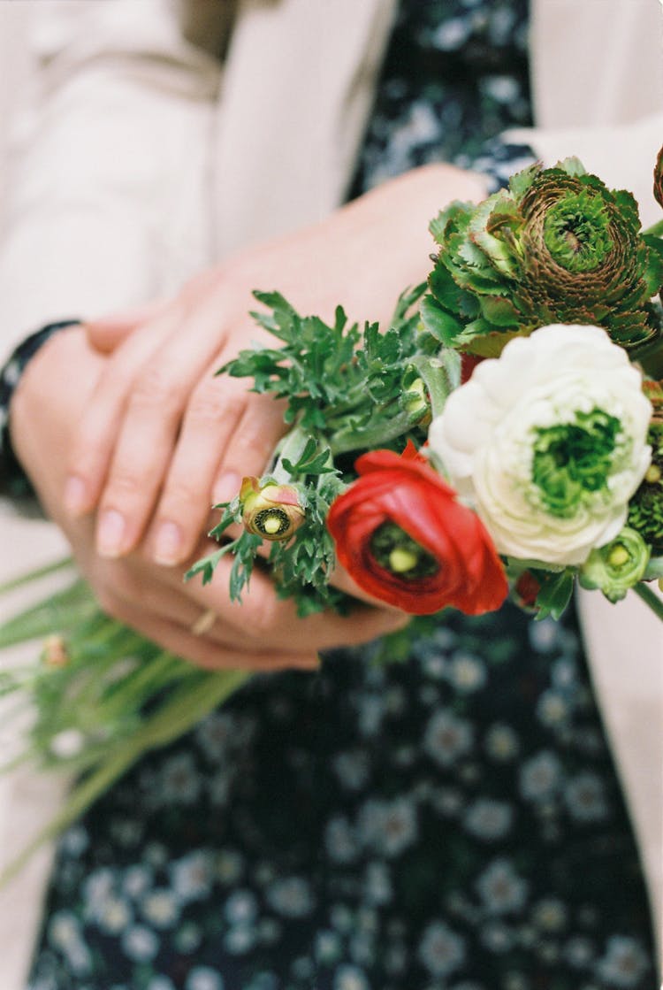 A Person Holding Flowers 