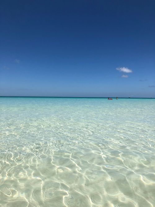 Free Breathtaking clear turquoise waters under a bright sky in the Philippines. Stock Photo