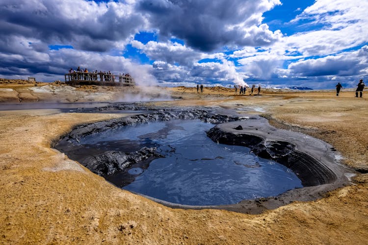 Group Of People Gather Near Hot Spring