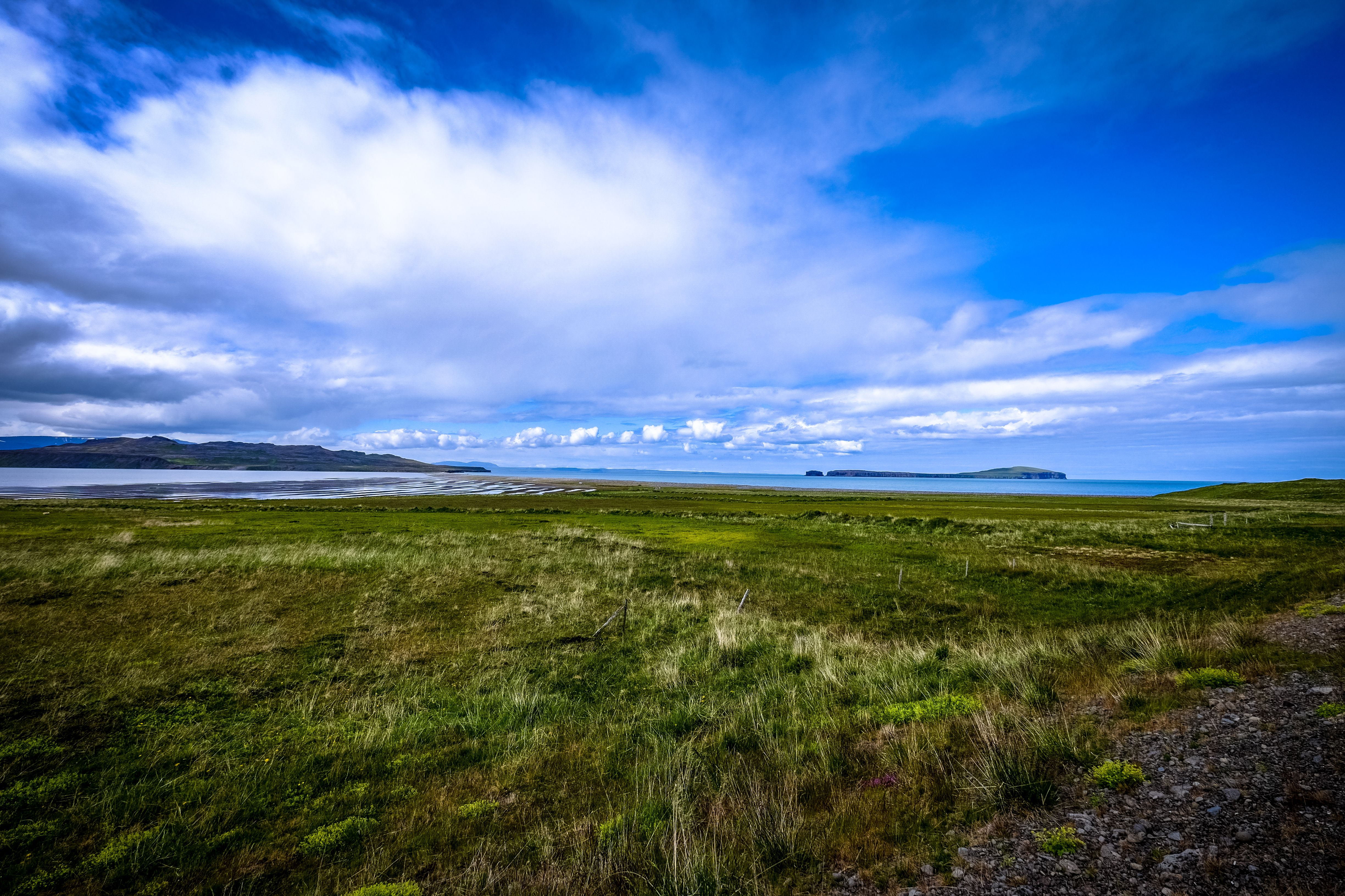 Scenic countryside landscape with vibrant sky and lush greenery, perfect for nature lovers.