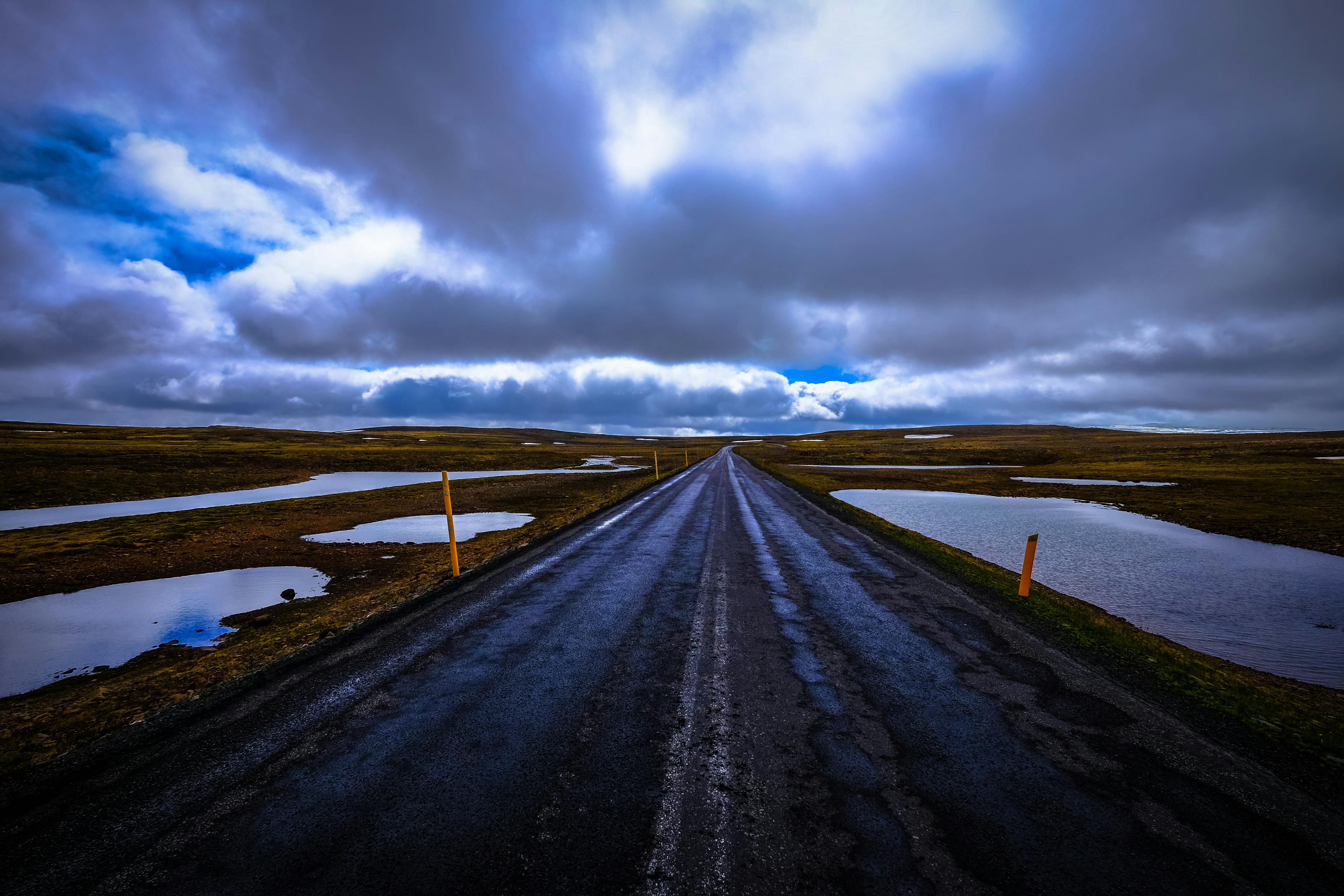 road surrounded with body of water