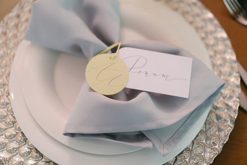A Flatware Under a Table Napkin with Tags