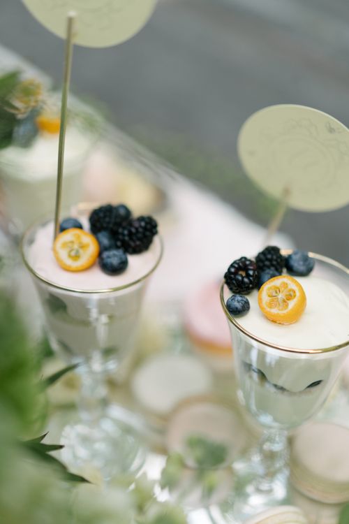Free Delicious dessert with berries and creamy layers served elegantly in glasses. Stock Photo