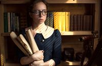 Woman in Blue Button Up Shirt Wearing Black Framed Eyeglasses