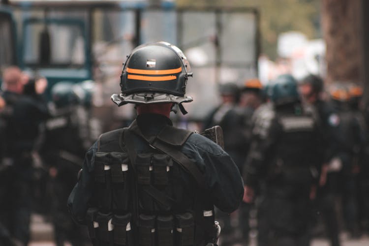 Police Officer In Helmet Maintaining Order