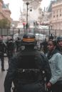 Armed police officer during protest meeting