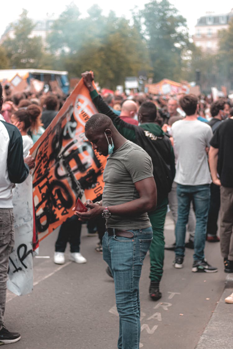 Black Man With Protective Mask Participating In Protest