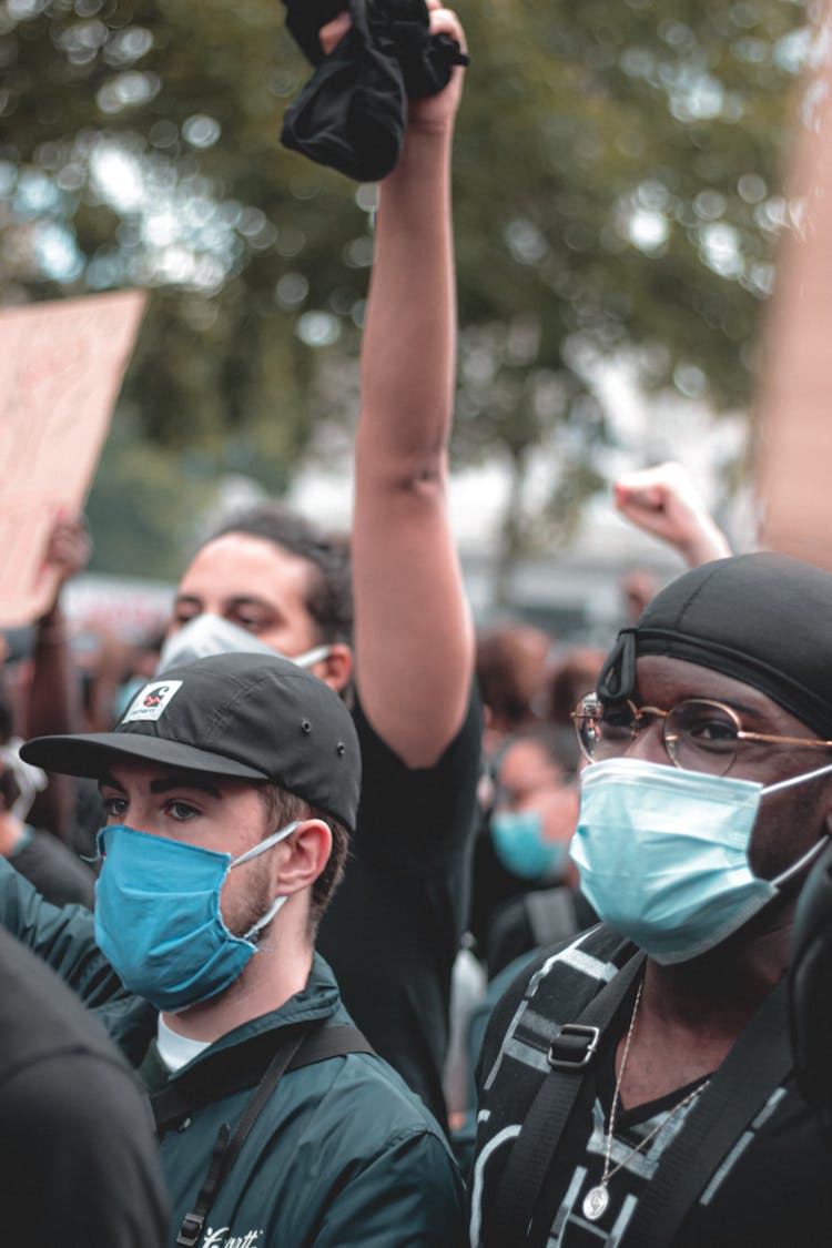 Group Of Young People In Medical Masks During Protest