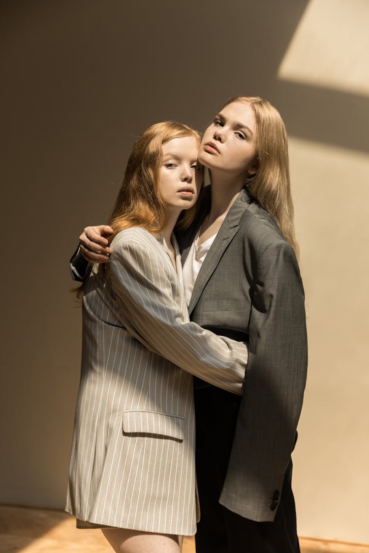 Redhead And Blonde Posing In Suits