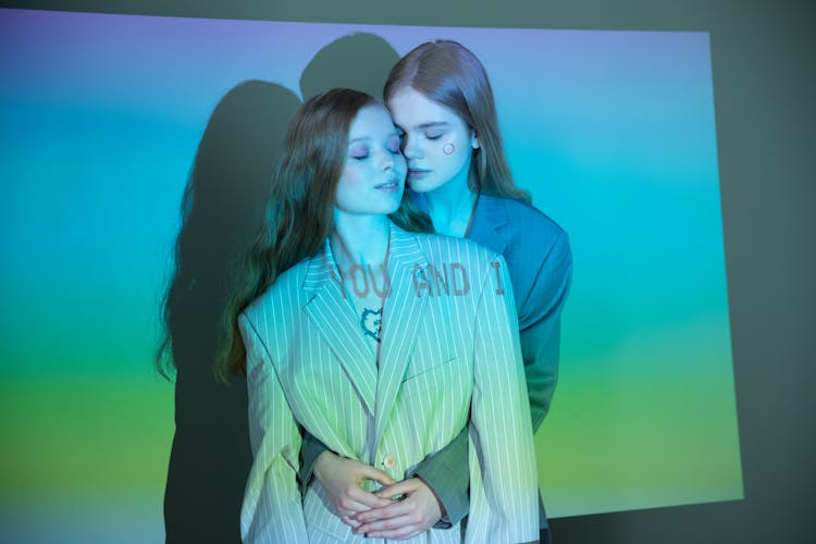 Couple Cuddle In Studio With Blue Lighting