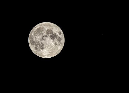 Free Luminous full moon on dark sky Stock Photo